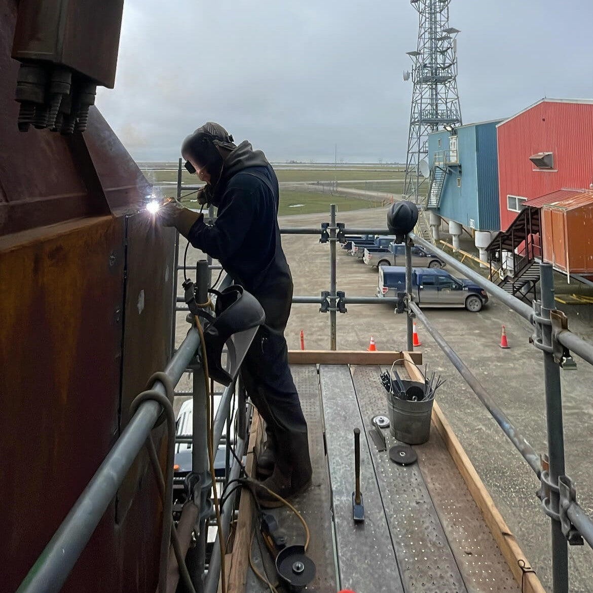 Person welding on a construction site