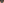         Close-up of a metallic object with a textured surface on a blurred natural background