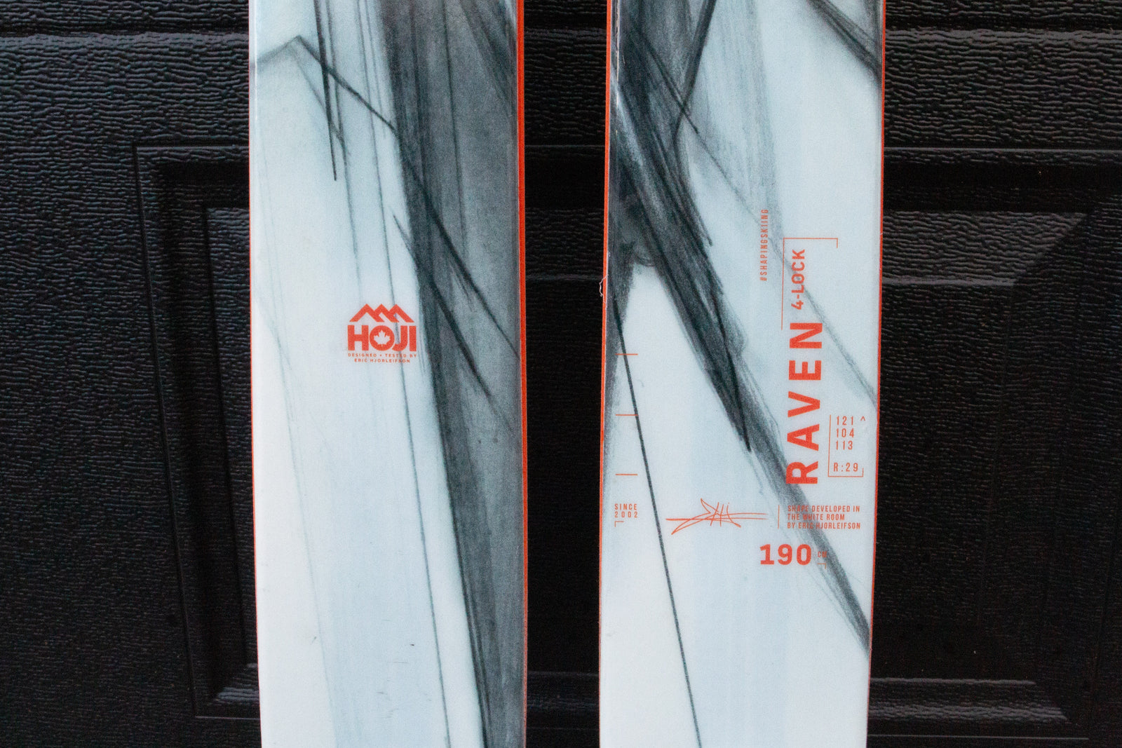 Close-up of a ski with 'HOJI' branding and 'Raven' model details.